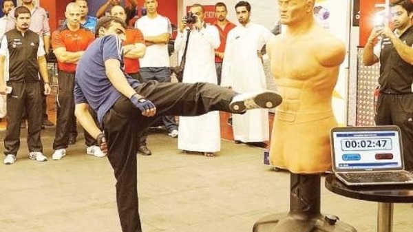 Ahmad Amin Bodla breaking the world record for number of kicks in three minutes. (Photo courtesy: Saudi Gazette)